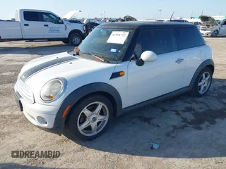 2009 MINI Cooper Hardtop with VIN WMWMF33569TZ20989, listed as a IAAI auction lot 41994772 with 152,944 mi miles. Bid and sale history available at carsss.com. Image 2.