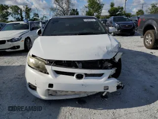 2011 Scion tC z VIN JTKJF5C70B3002270, wystawiony jako Copart lot #56605055 z przebiegiem 115 097 mil mil oraz Szkody całkowita. Historia ofert i sprzedaży dostępna na DreamBid. Obrazek 5.