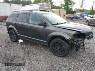 2017 Dodge Journey SE z VIN 3C4PDCAB5HT608115, wystawiony jako IAAI lot #42107602 z przebiegiem 91 928 mil mil oraz . Historia ofert i sprzedaży dostępna na DreamBid. Obrazek 1.