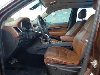 2015 Jeep Grand Cherokee Summit with VIN 1C4RJFJTXFC661574, listed as a Copart auction lot 65592954 with 110,791 mi miles and Salvage Title. Bid and sale history available at carsss.com. Image 7.