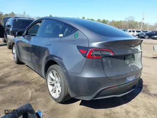 2023 Tesla Model Y Long Range with VIN 7SAYGDEEXPA175104, listed as a IAAI auction lot 41821928 with 52,791 mi miles. Bid and sale history available at carsss.com. Image 3.