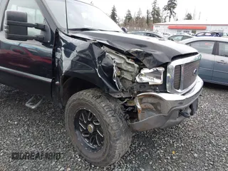 1999 Ford Super Duty F-250 XL with VIN 1FTNX21F2XEC99584, listed as a IAAI auction lot 41611098 with 424,263 mi miles. Bid and sale history available at carsss.com. Image 6.