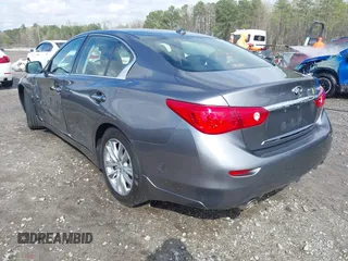 2015 Infiniti Q50 with VIN JN1BV7AP2FM332816, listed as a IAAI auction lot 41864532 with 180,683 mi miles. Bid and sale history available at carsss.com. Image 3.