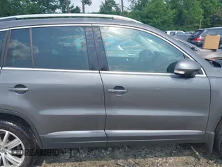 2014 Volkswagen Tiguan SE z VIN WVGAV3AX0EW576108, wystawiony jako IAAI lot #42405804 z przebiegiem 117 530 mil mil oraz . Historia ofert i sprzedaży dostępna na DreamBid. Obrazek 13.