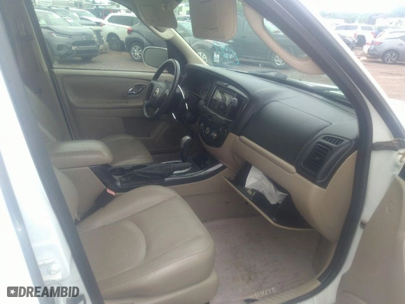2006 Mazda Tribute i with VIN 4F2YZ02Z06KM26613, listed as a IAAI auction lot 41847931 with 145,164 mi miles. Bid and sale history available at carsss.com. Image 5.