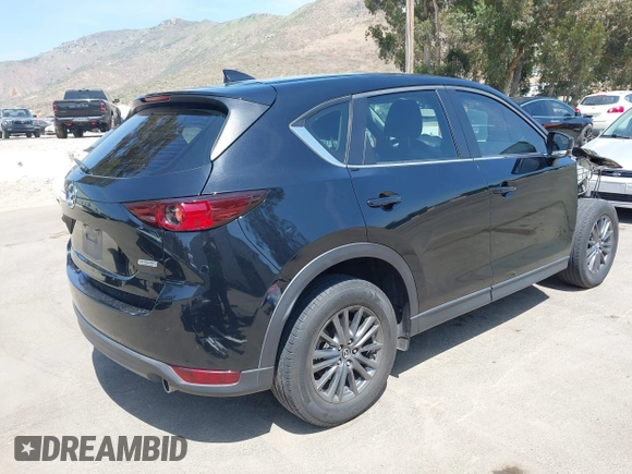 2019 Mazda CX-5 Sport with VIN JM3KFABM7K1509987, listed as a IAAI auction lot 42062804 with 50,898 mi miles and . Bid and sale history available at DreamBid. Image 4.