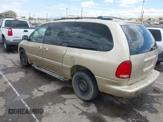 1999 Chrysler Town & Country LXi with VIN 1C4GP54L0XB512495, listed as a IAAI auction lot 39677461 with 284,495 mi miles. Bid and sale history available at carsss.com. Image 3.