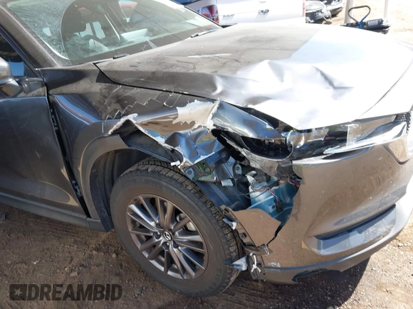 2021 Mazda CX-5 Touring with VIN JM3KFACM2M1313750, listed as a IAAI auction lot 41762938 with 68,503 mi miles. Bid and sale history available at carsss.com. Image 6.