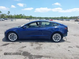 2023 Tesla Model 3 with VIN 5YJ3E1EA0PF658080, listed as a IAAI auction lot 42008846 with 32,301 mi miles and . Bid and sale history available at carsss.com. Image 15.