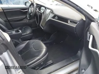 2013 Tesla Model S with VIN 5YJSA1DG7DFP11382, listed as a IAAI auction lot 42056169 with 126,975 mi miles. Bid and sale history available at carsss.com. Image 5.