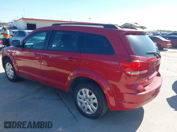 2015 Dodge Journey SE z VIN 3C4PDCAB5FT679585, wystawiony jako IAAI lot #42090600 z przebiegiem 166 876 mil mil oraz . Historia ofert i sprzedaży dostępna na DreamBid. Obrazek 3.