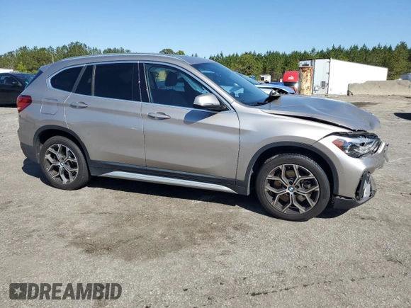 2021 BMW X1 sDrive28i with VIN WBXJG7C0XM5S33884, listed as a Copart auction lot 48413405 with 89,698 mi miles and Salvage Title. Bid and sale history available at DreamBid. Image 4.