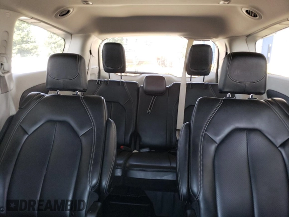 2023 Chrysler Pacifica Touring L with VIN 2C4RC1BG1PR581376, listed as a Copart auction lot 59901915 with 57,411 mi miles and Salvage title. Bid and sale history available at DreamBid. Image 10.
