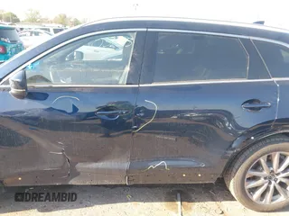2020 Mazda CX-9 Grand Touring with VIN JM3TCADY0L0422548, listed as a IAAI auction lot 41839601 with 116,952 mi miles and . Bid and sale history available at DreamBid. Image 14.