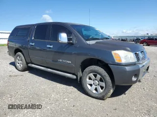 2005 Nissan Titan LE with VIN 1N6BA07B95N571880, listed as a Copart auction lot 57527435 with 199,577 mi miles and Salvage title. Bid and sale history available at DreamBid. Image 4.