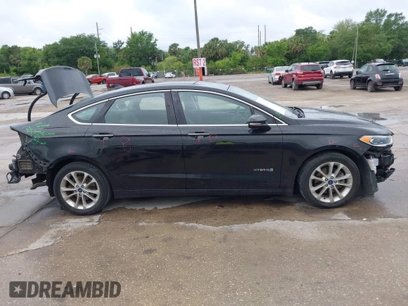 2019 Ford Fusion Hybrid SEL with VIN 3FA6P0MU1KR202860, listed as a IAAI auction lot 41983299 with 133,671 mi miles. Bid and sale history available at carsss.com. Image 14.