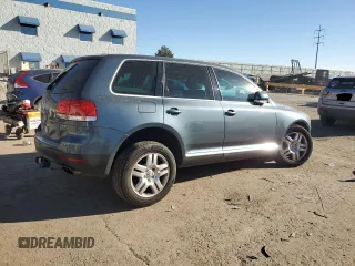 2004 Volkswagen Touareg z VIN WVGEM77L64D051760, wystawiony jako Copart lot #87044304 z przebiegiem Nie podano mil oraz Szkoda całkowita • Salvage title. Historia ofert i sprzedaży dostępna na DreamBid. Obrazek 3.