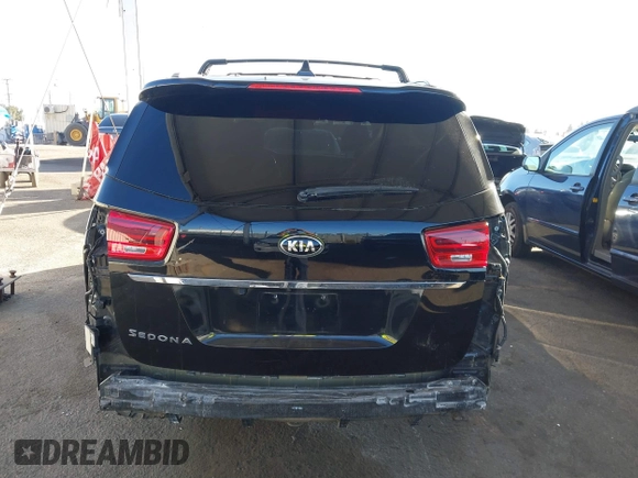 2021 Kia Sedona EX with VIN KNDMC5C10M6671729, listed as a IAAI auction lot 40858206 with 58,775 mi miles. Bid and sale history available at carsss.com. Image 17.