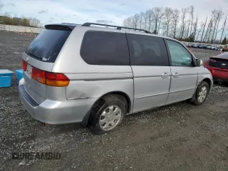 2002 Honda Odyssey EX z VIN 2HKRL18692H578746, wystawiony jako Copart lot #51281845 z przebiegiem 282 844 mil mil oraz Szkoda całkowita • Salvage title. Historia ofert i sprzedaży dostępna na DreamBid. Obrazek 3.