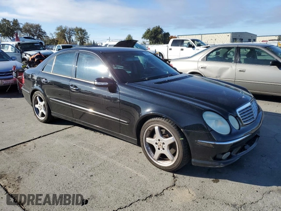 2004 Mercedes-Benz E-Class 5.0L with VIN WDBUF70J64A585084, listed as a Copart auction lot 80297124 with 233,638 mi miles and Salvage Title. Bid and sale history available at carsss.com. Image 4.