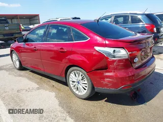 2015 Ford Focus Titanium with VIN 1FADP3J29FL230664, listed as a IAAI auction lot 41870083 with 125,578 mi miles and . Bid and sale history available at DreamBid. Image 3.