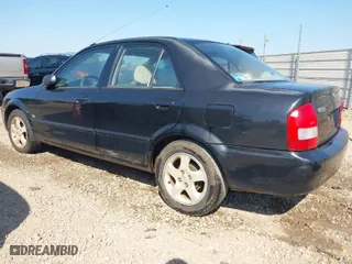 2001 Mazda Protege LX with VIN JM1BJ225410469975, listed as a IAAI auction lot 42035389 with 252,022 mi miles. Bid and sale history available at carsss.com. Image 3.