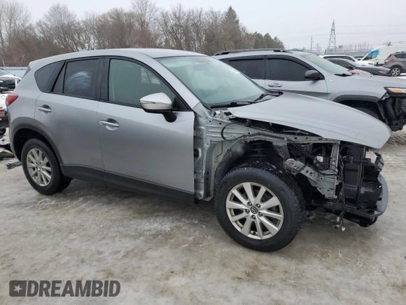 2015 Mazda CX-5 Sport with VIN JM3KE4BEXF0499688, listed as a Copart auction lot 88988095 with 258,460 mi miles and Salvage title. Bid and sale history available at DreamBid. Image 4.