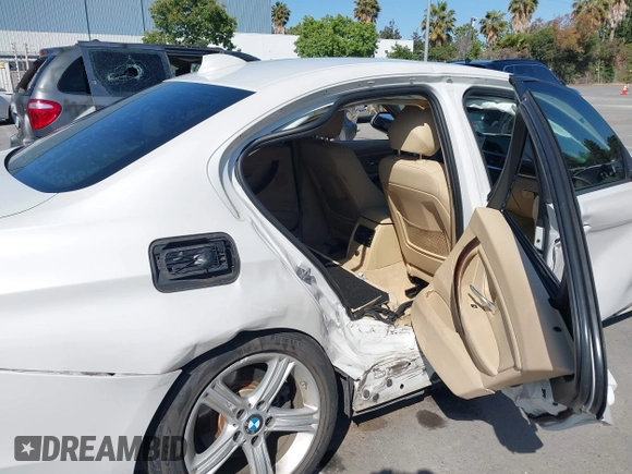 2014 BMW 3 Series 320i with VIN WBA3B1G50ENN90657, listed as a IAAI auction lot 42304612 with 129,377 mi miles and . Bid and sale history available at DreamBid. Image 18.