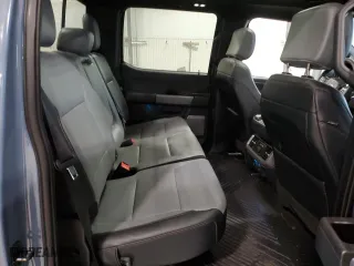 2023 Ford F-150 Lightning Pro with VIN 1FT6W1EV4PWG47236, listed as a Copart auction lot 43584015 with 15,411 mi miles and Salvage Title. Bid and sale history available at carsss.com. Image 10.