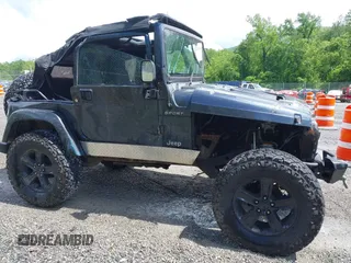 2003 Jeep Wrangler Sport z VIN 1J4FA49S53P317779, wystawiony jako IAAI lot #42388780 z przebiegiem Nie podano mil oraz . Historia ofert i sprzedaży dostępna na DreamBid. Obrazek 12.