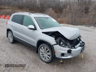 2016 Volkswagen Tiguan SEL z VIN WVGBV7AX3GW594729, wystawiony jako IAAI lot #41233805 z przebiegiem 92 997 mil mil oraz . Historia ofert i sprzedaży dostępna na DreamBid. Obrazek 1.