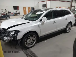 2013 Lincoln MKT EcoBoost with VIN 2LMHJ5AT3DBL56954, listed as a IAAI auction lot 41705877 with 148,771 mi miles. Bid and sale history available at carsss.com. Image 2.