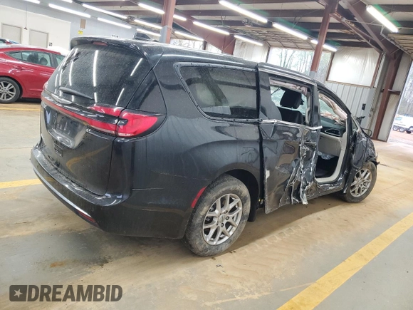 2023 Chrysler Pacifica Touring L with VIN 2C4RC1BG3PR582271, listed as a Copart auction lot 51644595 with 57,930 mi miles and Salvage title. Bid and sale history available at DreamBid. Image 3.