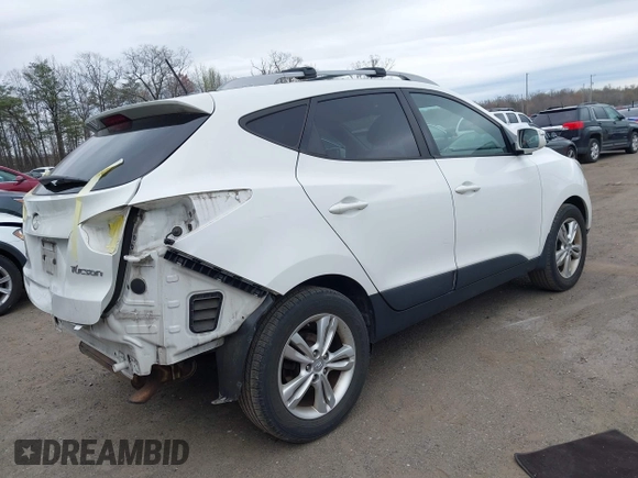 2013 Hyundai Tucson GLS with VIN KM8JU3AC5DU693550, listed as a IAAI auction lot 41919615 with 202,517 mi miles. Bid and sale history available at carsss.com. Image 4.