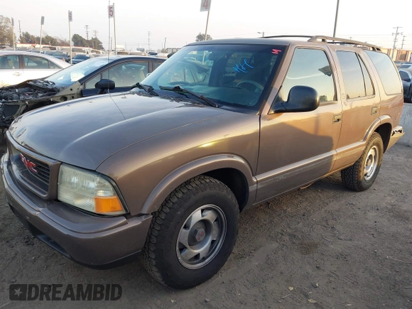 1998 GMC Jimmy SL with VIN 1GKCS13W1W2562133, listed as a IAAI auction lot 41159010 with 277,799 mi miles. Bid and sale history available at carsss.com. Image 18.
