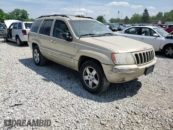 2000 Jeep Grand Cherokee Limited z VIN 1J4GW58N0YC272532, wystawiony jako Copart lot #57524225 z przebiegiem 238 921 mil mil oraz Szkoda całkowita • Salvage title. Historia ofert i sprzedaży dostępna na DreamBid. Obrazek 14.