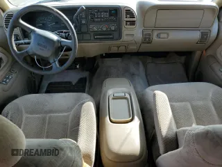 1999 GMC Suburban with VIN 3GKEC16R0XG526194, listed as a Copart auction lot 83740634 with 199,583 mi miles and Clean title. Bid and sale history available at DreamBid. Image 8.