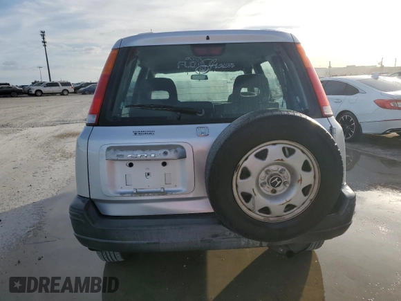 1999 Honda CR-V LX with VIN JHLRD2844XC016583, listed as a Copart auction lot 73747274 with 104,730 mi miles and Salvage Title. Bid and sale history available at carsss.com. Image 6.