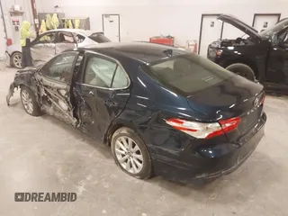 2020 Toyota Camry LE with VIN 4T1C11AK5LU926564, listed as a IAAI auction lot 41864812 with 104,212 mi miles and . Bid and sale history available at carsss.com. Image 3.