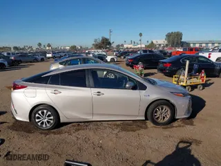 2021 Toyota Prius Prime LE with VIN JTDKAMFP1M3178179, listed as a IAAI auction lot 41233411 with 83,035 mi miles. Bid and sale history available at carsss.com. Image 14.