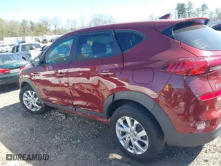 2019 Hyundai Tucson SE with VIN KM8J23A45KU931585, listed as a IAAI auction lot 41797137 with 101,559 mi miles. Bid and sale history available at carsss.com. Image 6.