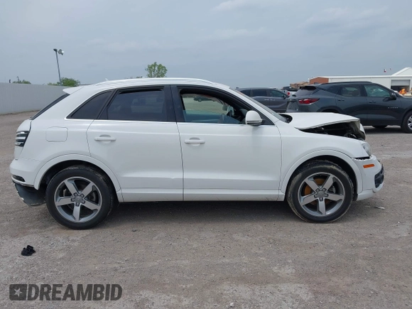 2015 Audi Q3 Premium Plus z VIN WA1EFCFS7FR006939, wystawiony jako IAAI lot #42067797 z przebiegiem 97 663 mil mil oraz . Historia ofert i sprzedaży dostępna na DreamBid. Obrazek 13.