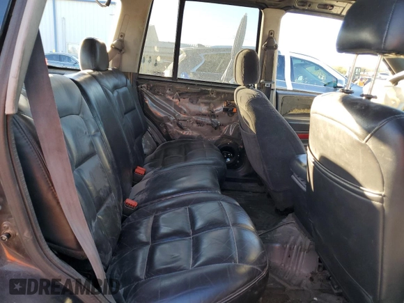 1998 Jeep Grand Cherokee Laredo with VIN 1J4FX58S4WC102623, listed as a Copart auction lot 86188764 with 283,210 mi miles and Salvage Title. Bid and sale history available at carsss.com. Image 12.