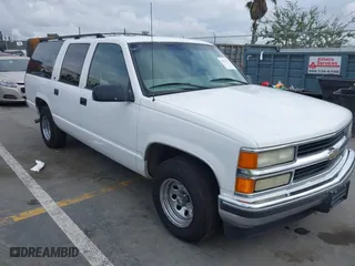 1999 Chevrolet Suburban with VIN 3GNEC16R2XG247140, listed as a IAAI auction lot 41761237 with 202,121 mi miles. Bid and sale history available at carsss.com. Image 1.