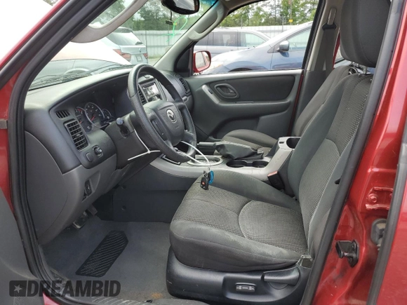 2005 Mazda Tribute S with VIN 4F2CZ04125KM19257, listed as a Copart auction lot 67370664 with 140,348 mi miles and Salvage Title. Bid and sale history available at DreamBid. Image 7.