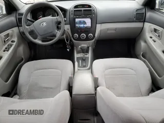 2009 Kia Spectra EX with VIN KNAFE221595657550, listed as a Copart auction lot 52805205 with 95,777 mi miles and Salvage Title. Bid and sale history available at DreamBid. Image 8.