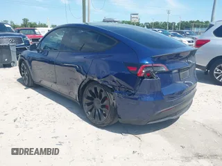 2023 Tesla Model Y Performance with VIN 7SAYGDEF9PF582908, listed as a IAAI auction lot 41930957 with 52,857 mi miles and . Bid and sale history available at DreamBid. Image 3.