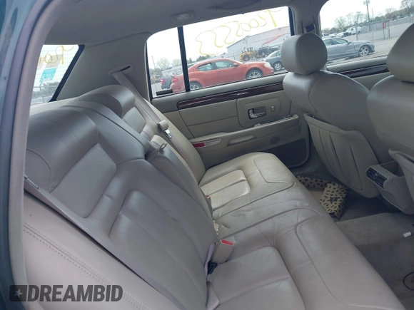 1999 Cadillac DeVille DHS z VIN 1G6KE54Y9XU766791, wystawiony jako IAAI lot #42005553 z przebiegiem 140 515 mil mil oraz . Historia ofert i sprzedaży dostępna na DreamBid. Obrazek 8.