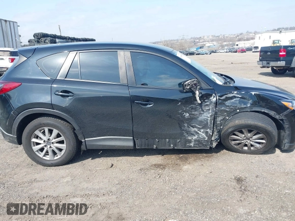2016 Mazda CX-5 Sport with VIN JM3KE4BY3G0843177, listed as a IAAI auction lot 41804094 with 193,461 mi miles. Bid and sale history available at carsss.com. Image 13.