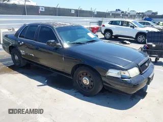 2011 Ford Police Interceptor z VIN 2FABP7BV4BX176064, wystawiony jako IAAI lot #42871911 z przebiegiem 98 858 mil mil oraz . Historia ofert i sprzedaży dostępna na DreamBid. Obrazek 1.